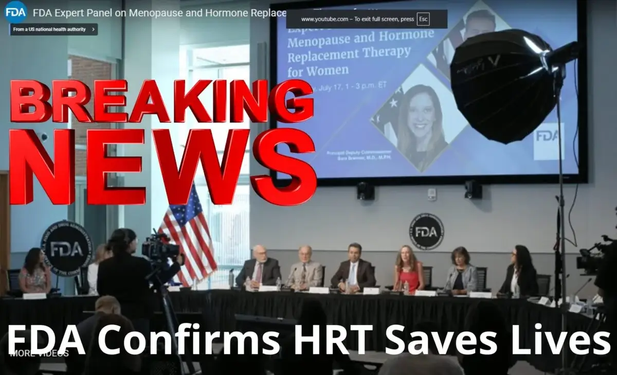 A panel of six experts sits at a table, with an audience watching. A screen behind them displays “Menopause and Hormone Replacement Therapy for Women.” Bold text reads, “FDA Confirms HRT Saves Lives.” The discussion highlights the importance of HRT and explores innovations such as bioidentical hormone replacement therapy, emphasizing the latest research and treatment options available to women today.