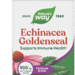 A bottle of Ashwagandha dietary supplement with 180 vegan capsules, featuring label details and images of the ashwagandha plant.